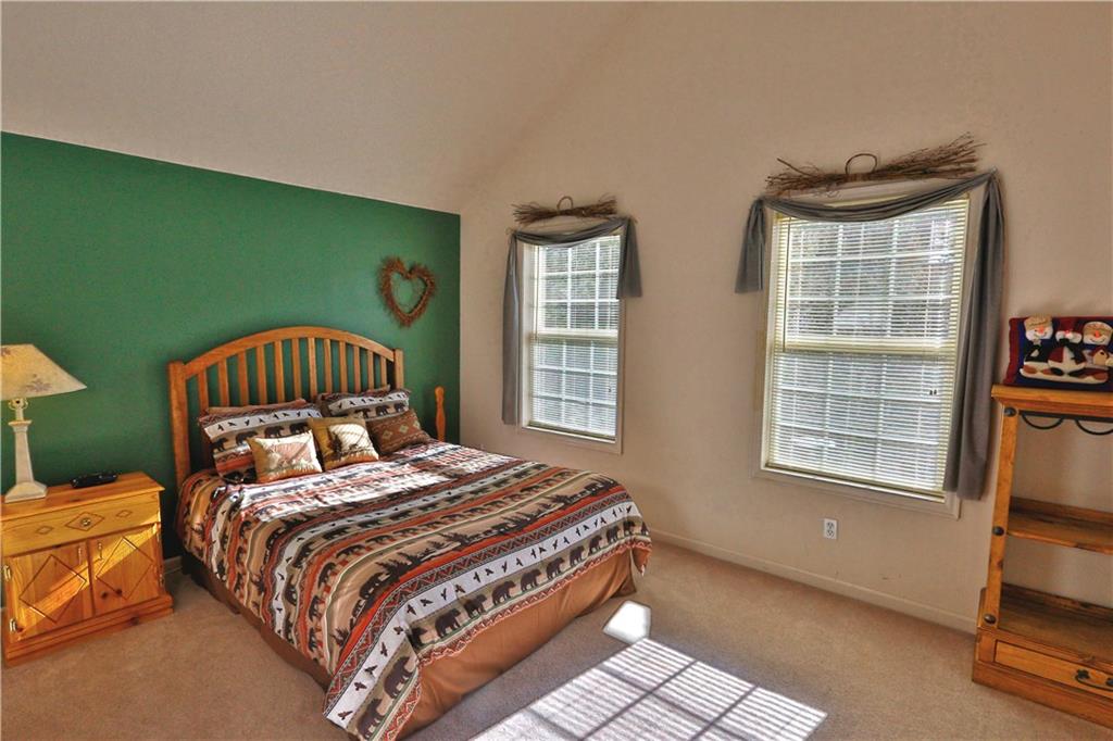 33 B Red Feather Road Breckenridge, CO 80424 - Photo 12 of 15 a bedroom with a bed and a window