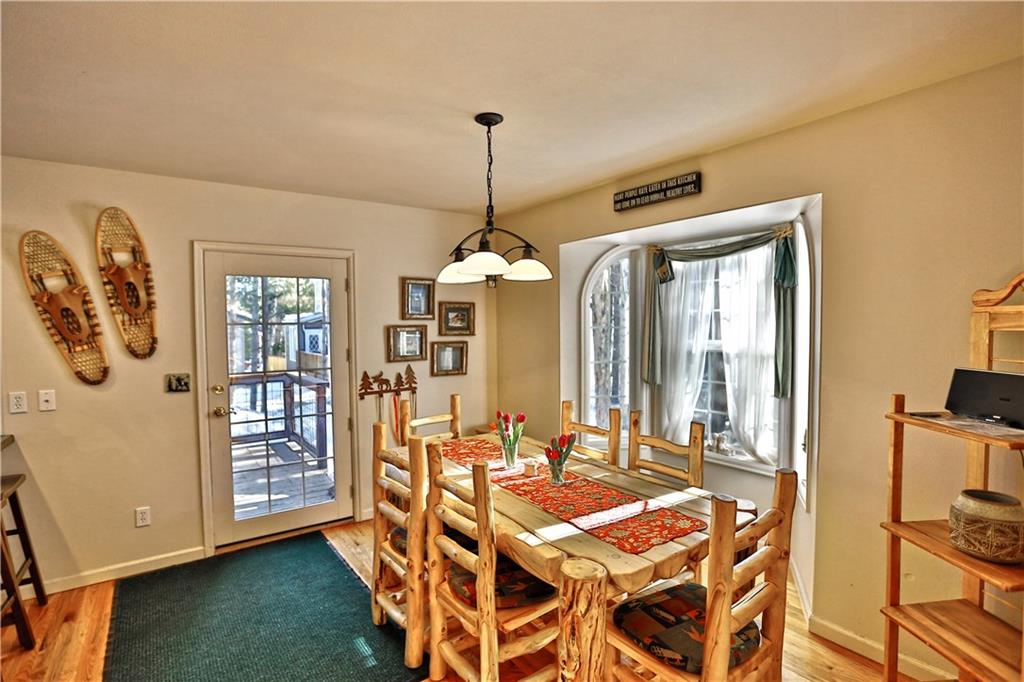 33 B Red Feather Road Breckenridge, CO 80424 - Photo 4 of 15 a dining room with furniture and window