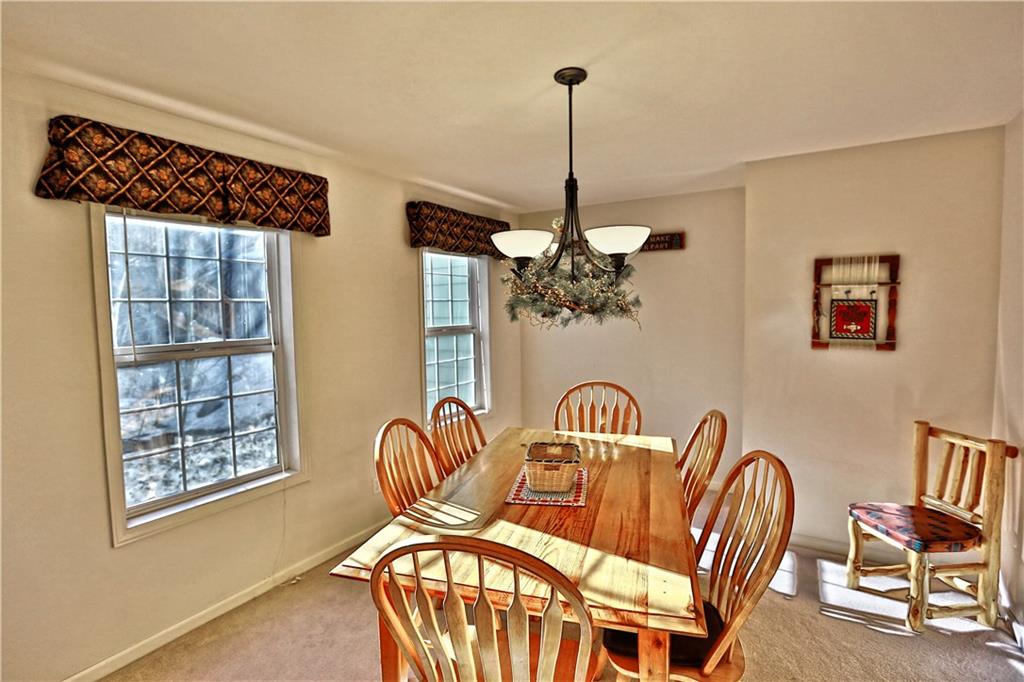 33 B Red Feather Road Breckenridge, CO 80424 - Photo 6 of 15 a view of a chairs and a table in a room