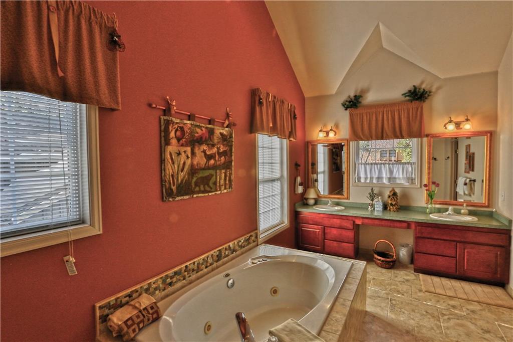 33 B Red Feather Road Breckenridge, CO 80424 - Photo 8 of 15 a bathroom with a tub sink and mirror
