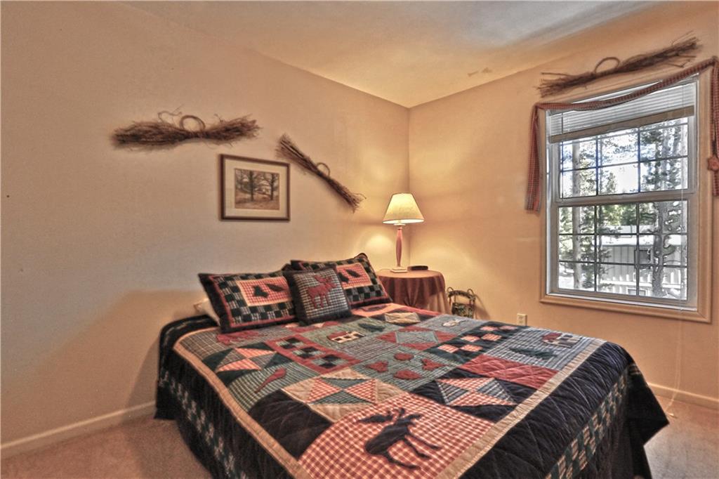 33 B Red Feather Road Breckenridge, CO 80424 - Photo 10 of 15 a bedroom with a bed and window