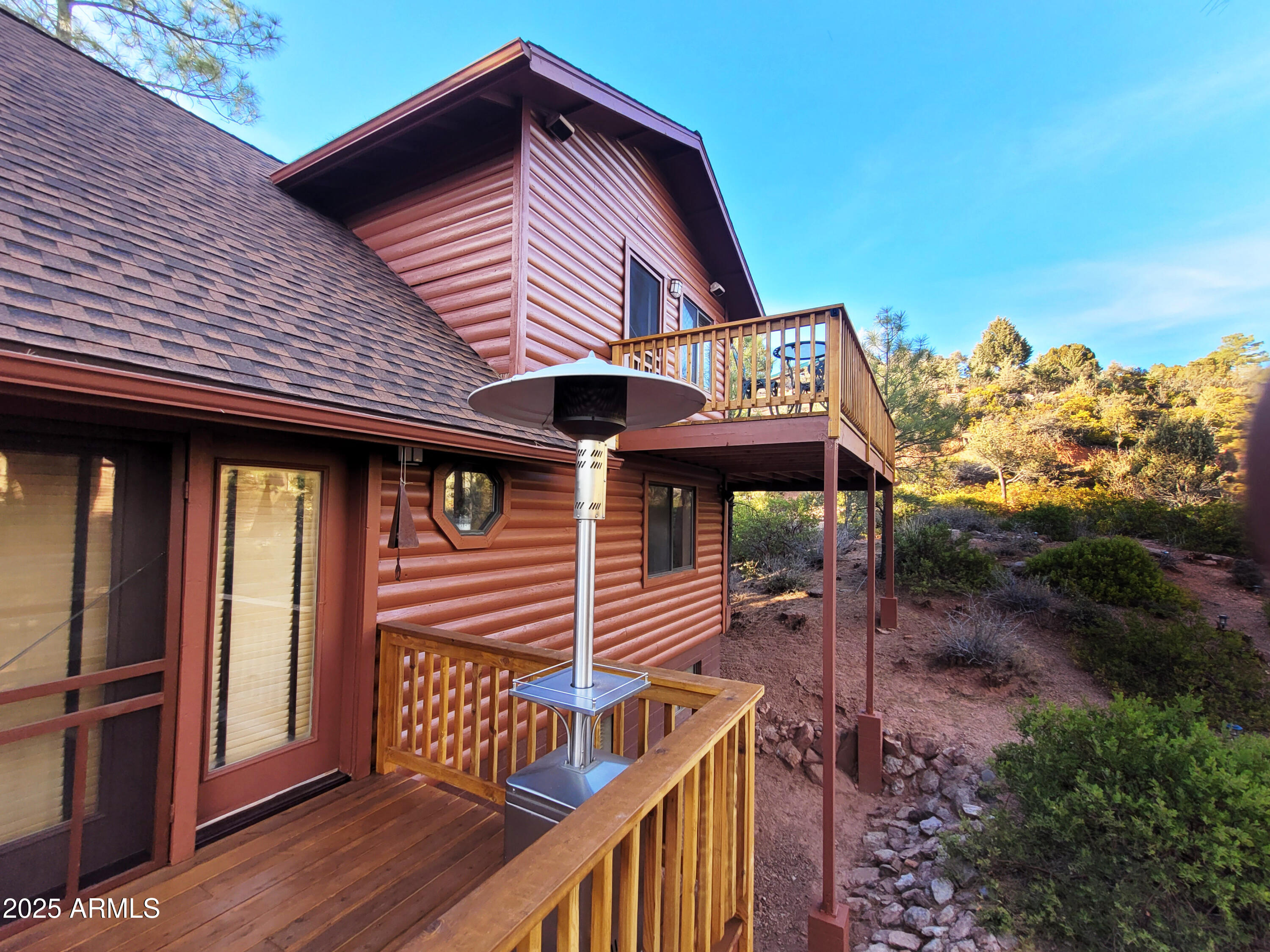 5579 Solitude Trail Loop Pine, AZ 85544 - Photo 16 of 50 a front view of a house with balcony