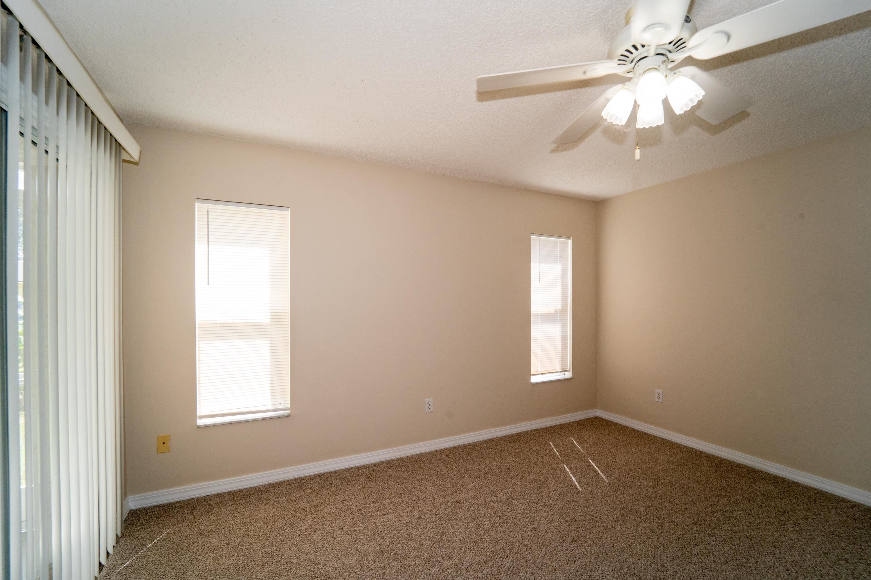 177 Marsh Island Circle St. Augustine, FL 32095 - Photo 16 of 33 an empty room with windows and fan
