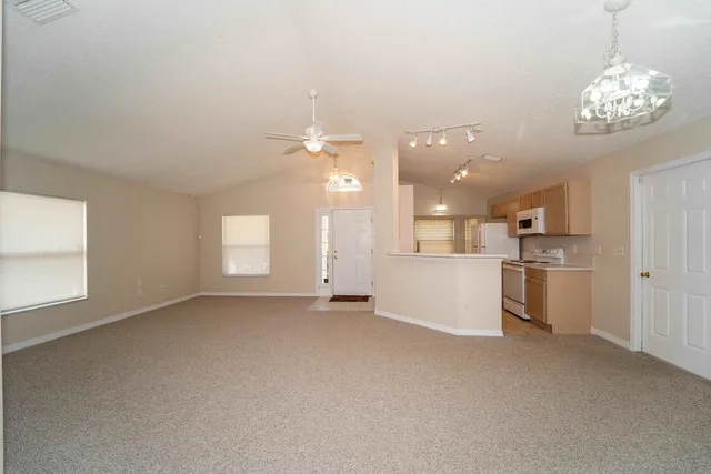 a view of a kitchen with a sink and a window