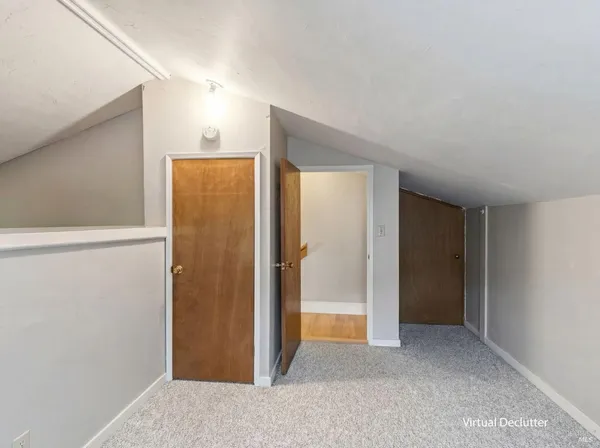 a bedroom with a bed and a tv