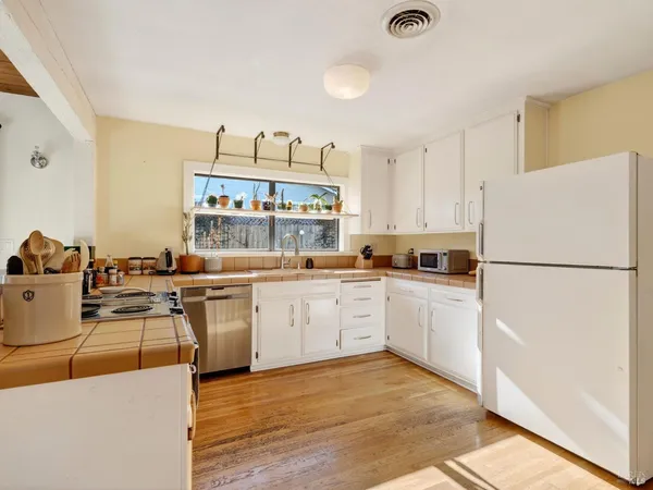 a kitchen with a sink and cabinets