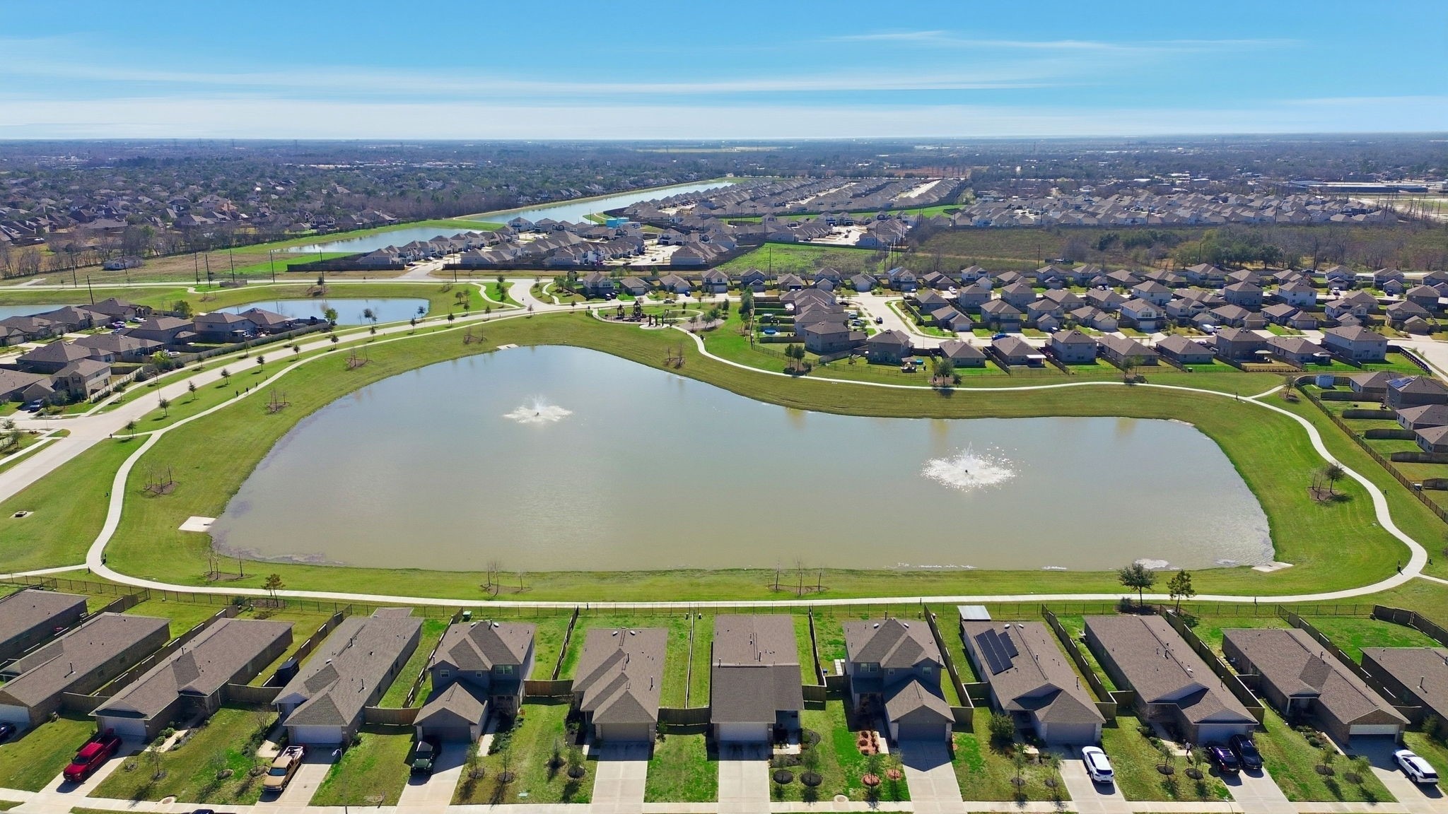 14502 Woodcott Warren Way Rosharon, TX 77583 - Photo 35 of 37 Enjoy access to scenic neighborhood lakes, two pools, playgrounds, walking trails, a picnic area, and a community clubhouse.