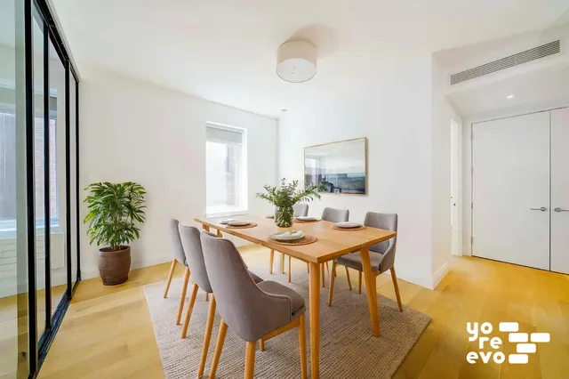 a kitchen with stainless steel appliances a stove a sink and a refrigerator