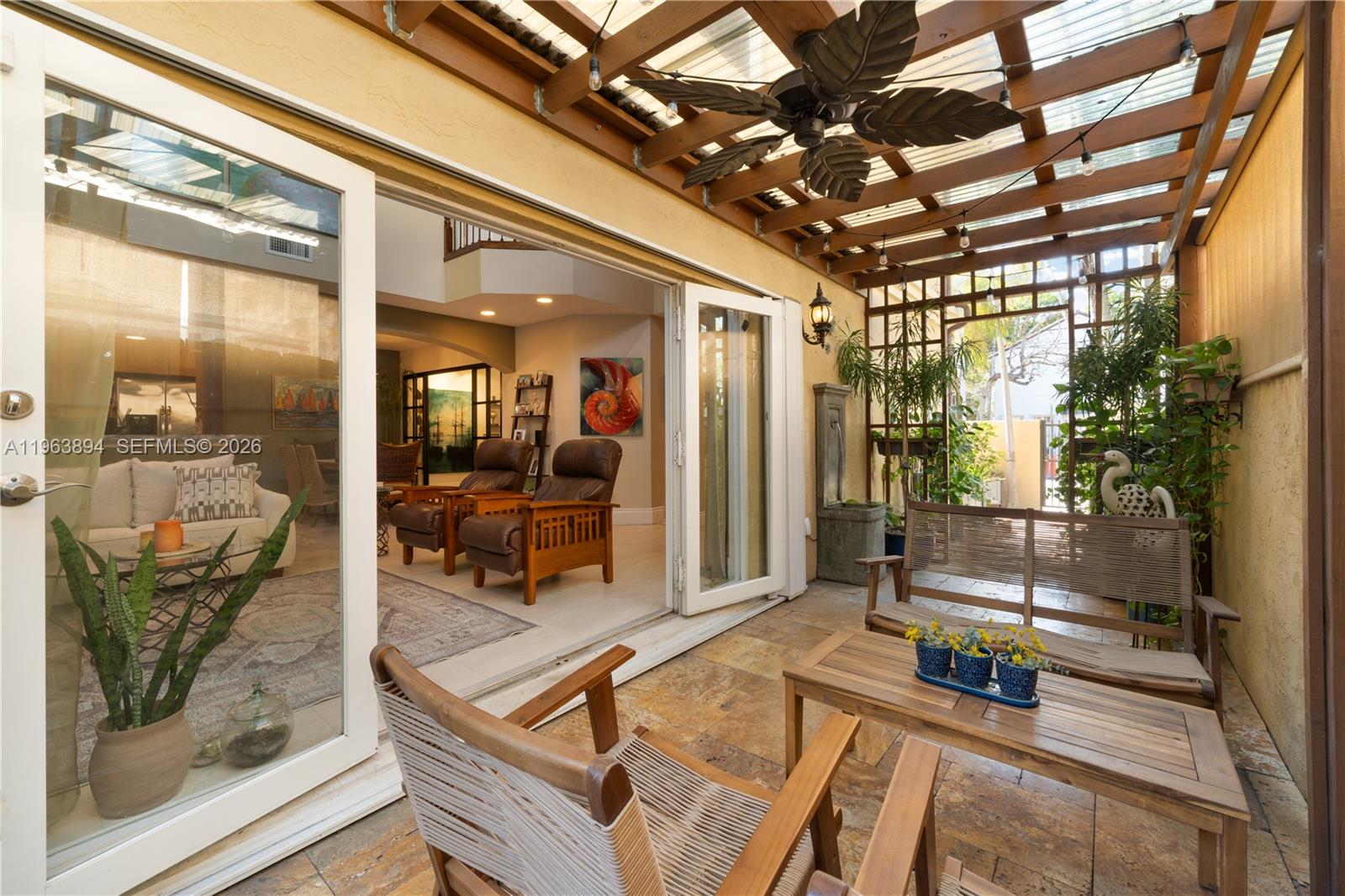 3197 Virginia Street Miami, FL 33133 - Photo 13 of 22 a room with lots of furniture and glass door