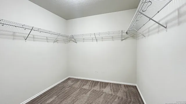 a view of a room with racks on the wall