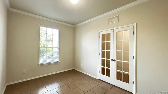 a view of empty room with windows