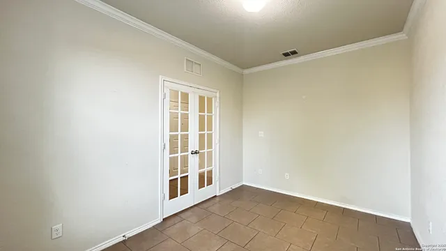 a view of empty room with windows