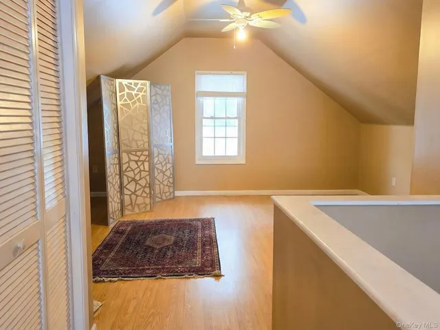 a bathroom with a tub and a window