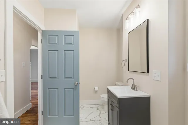 a view of a room with wooden floor and small space