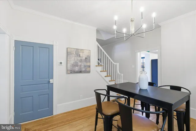 a view of entryway with wooden floor and stairs