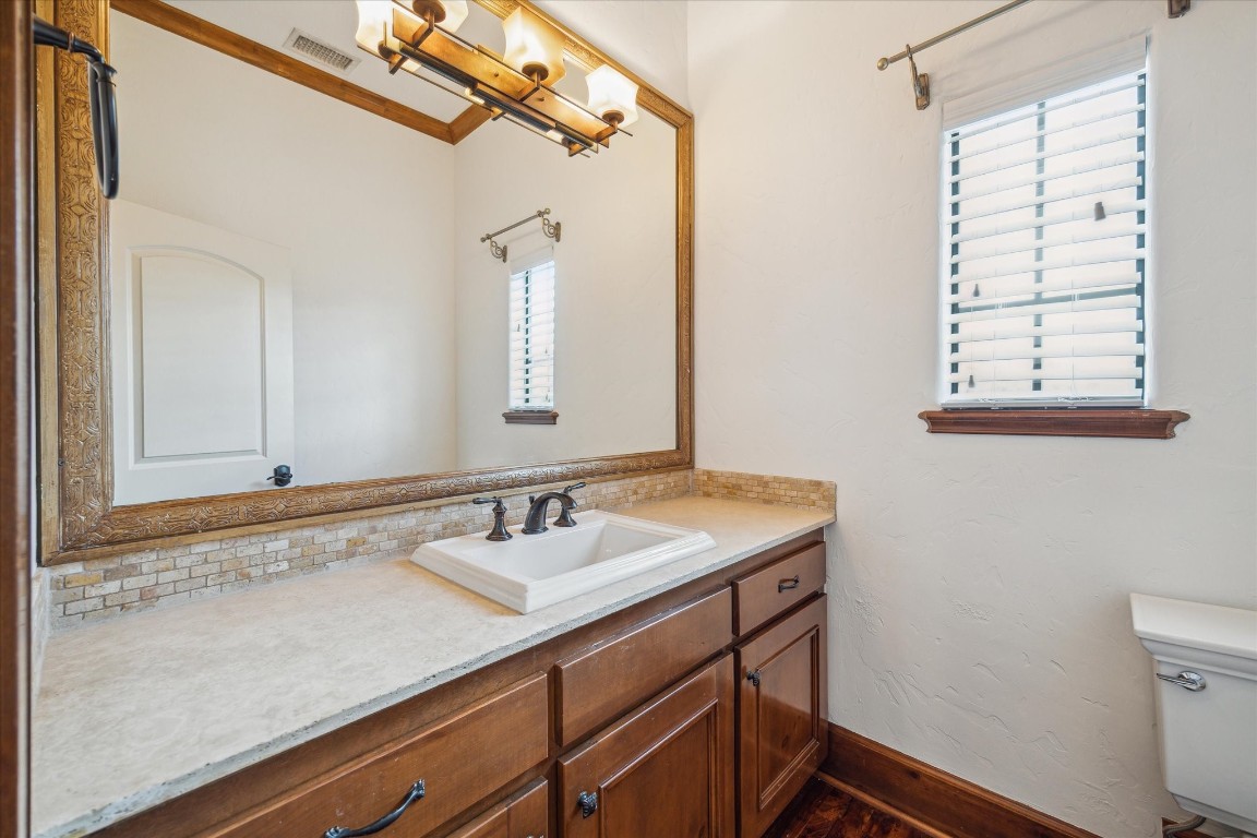 3614 Lancashire Street Houston, TX 77027 - Photo 11 of 47 a bathroom with a sink a vanity and a mirror