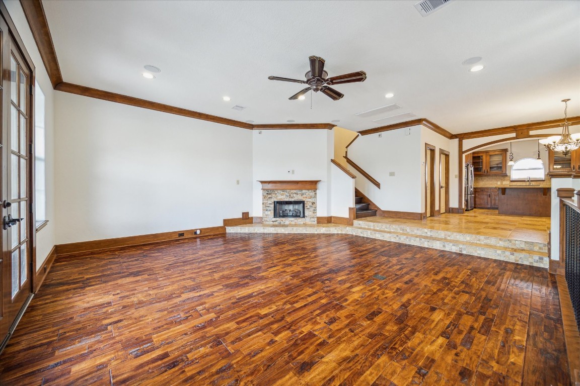 3614 Lancashire Street Houston, TX 77027 - Photo 14 of 47 a view of a livingroom with wooden floor a ceiling fan and staircase