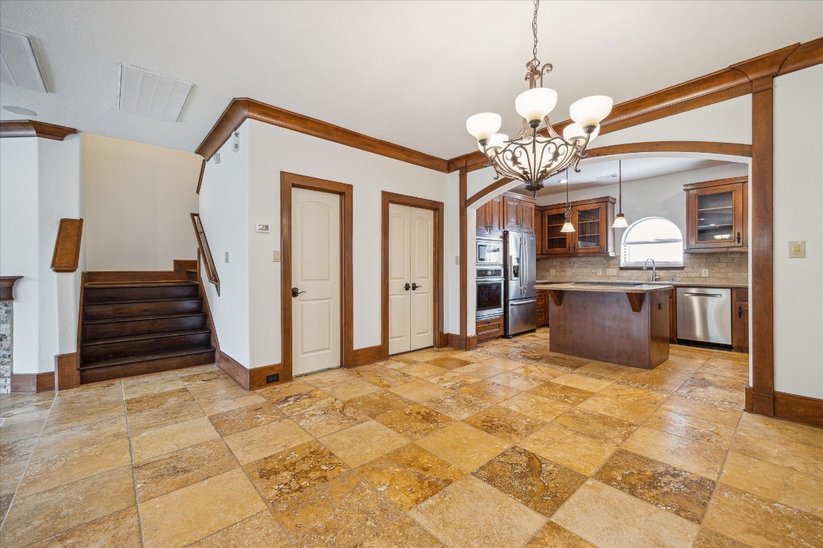 3614 Lancashire Street Houston, TX 77027 - Photo 17 of 47 a view of an empty room with a kitchen