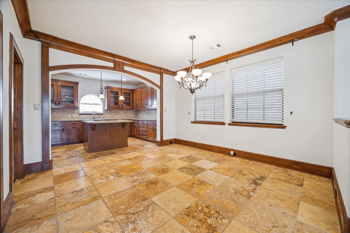 3614 Lancashire Street Houston, TX 77027 - Photo 18 of 47 a view of a kitchen with granite countertop cabinets and a floor to ceiling window