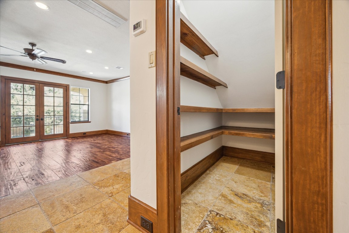 3614 Lancashire Street Houston, TX 77027 - Photo 24 of 47 a view of a hallway to an empty room and window