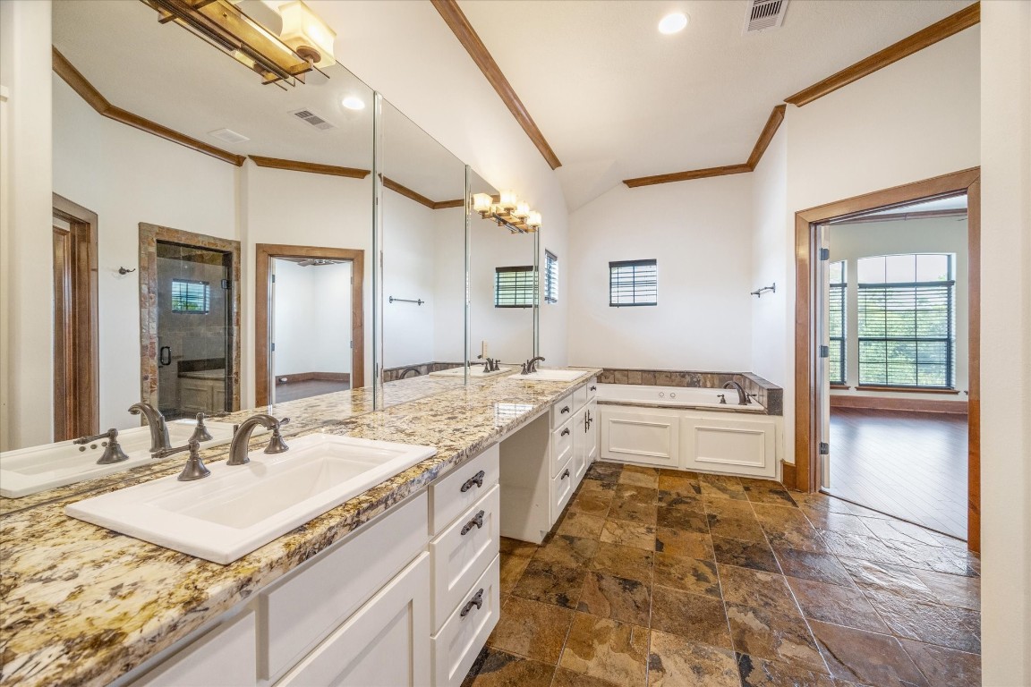 3614 Lancashire Street Houston, TX 77027 - Photo 32 of 47 a bathroom with a granite countertop sink mirror and a bath tub
