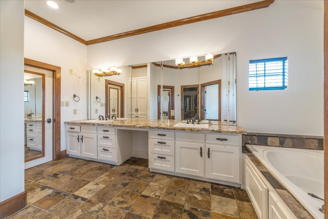 3614 Lancashire Street Houston, TX 77027 - Photo 33 of 47 a spacious bathroom with a granite countertop sink mirror and a