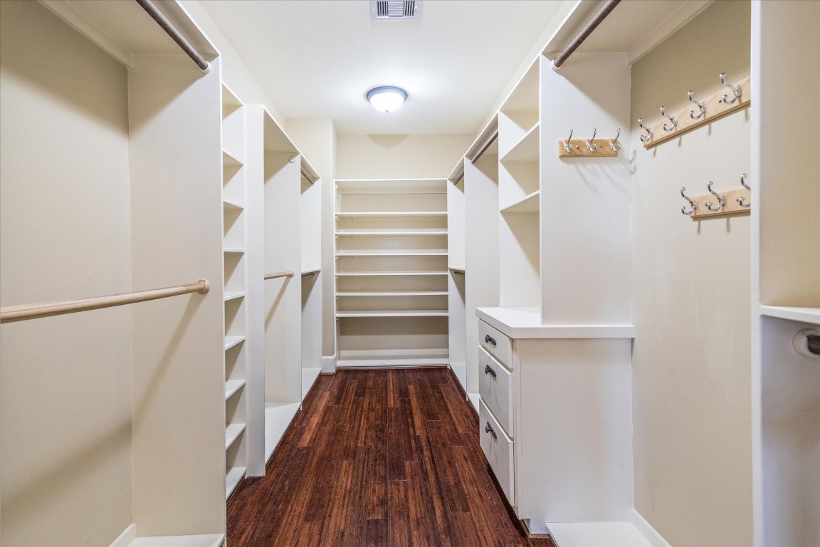 3614 Lancashire Street Houston, TX 77027 - Photo 35 of 47 a view of walk in closet with wooden floor