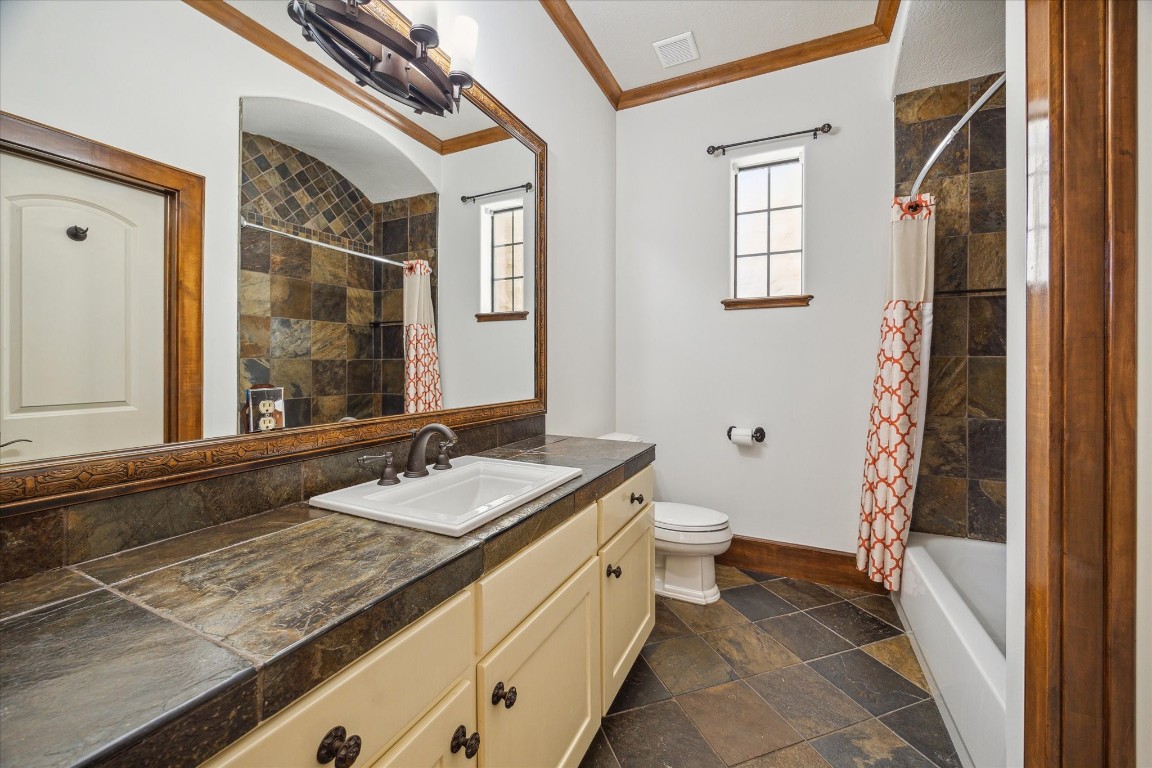 3614 Lancashire Street Houston, TX 77027 - Photo 40 of 47 a bathroom with a granite countertop sink and a mirror