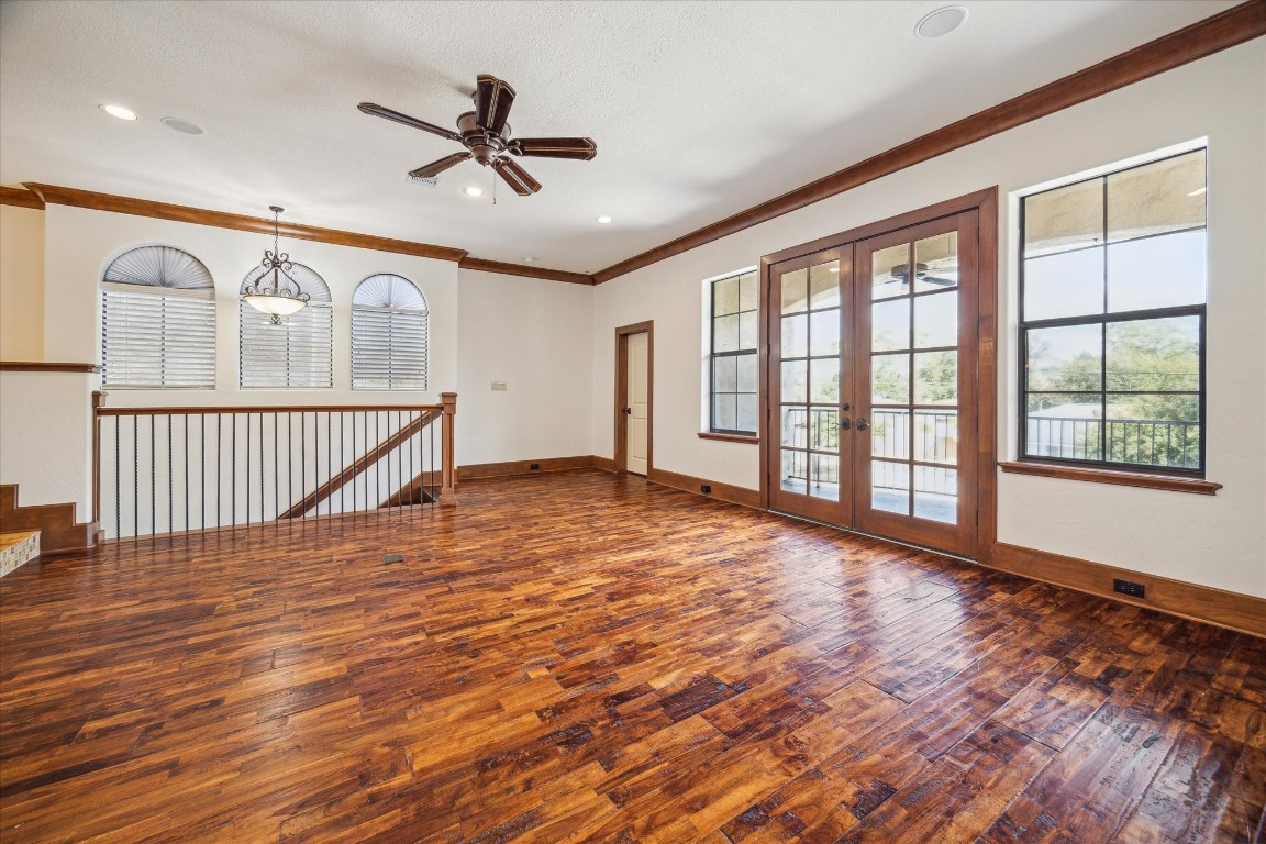 3614 Lancashire Street Houston, TX 77027 - Photo 10 of 47 a view of an empty room with wooden floor and a window