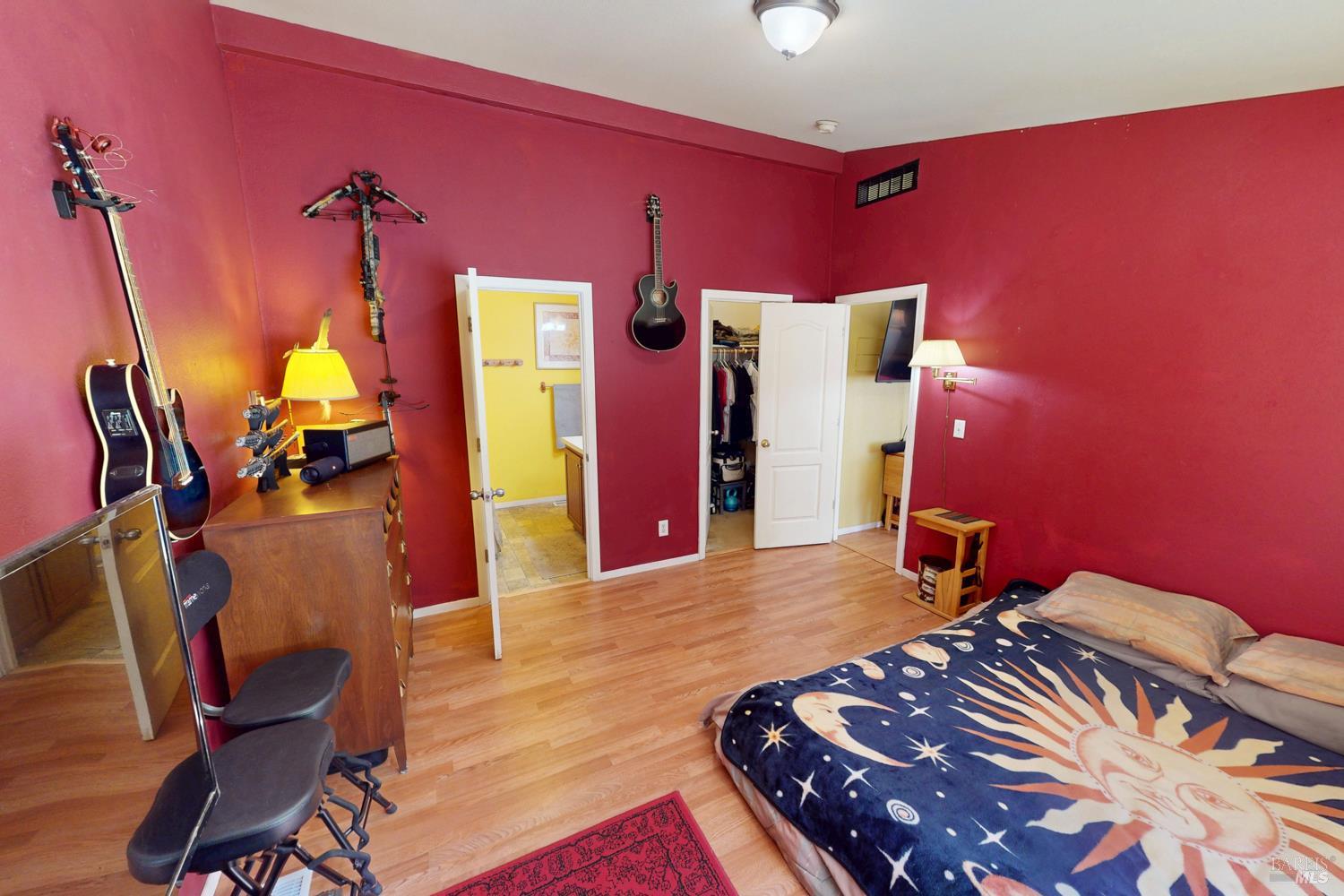 28001 Tenmile Road Gualala, CA 95445 - Photo 11 of 32 a bedroom with bed and a mirror