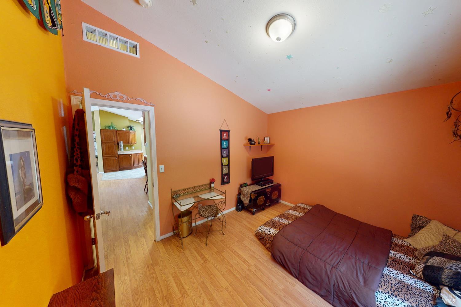 28001 Tenmile Road Gualala, CA 95445 - Photo 12 of 32 a bed room with a bed and a chair