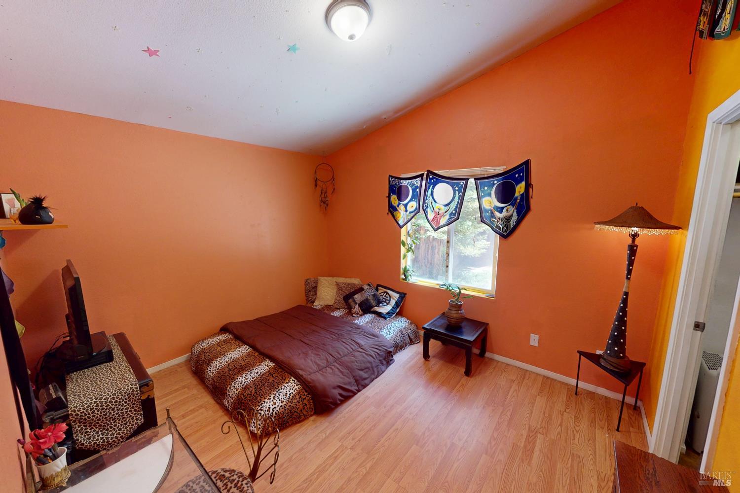 28001 Tenmile Road Gualala, CA 95445 - Photo 13 of 32 a living room with furniture and a wooden floor