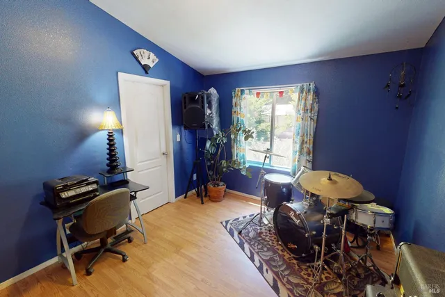 a bed room with a bed and a window