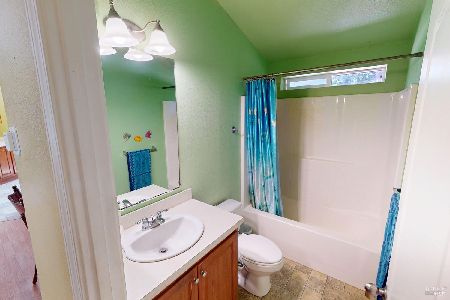 28001 Tenmile Road Gualala, CA 95445 - Photo 16 of 32 a bathroom with a sink toilet and shower