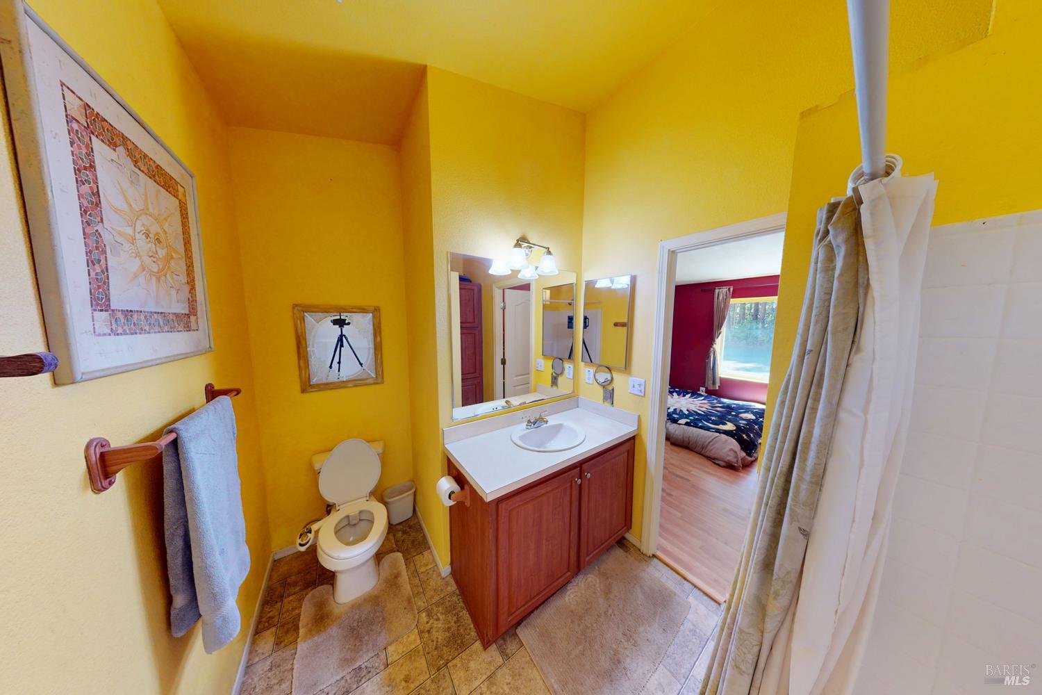 28001 Tenmile Road Gualala, CA 95445 - Photo 18 of 32 a room with furniture and a flat screen tv