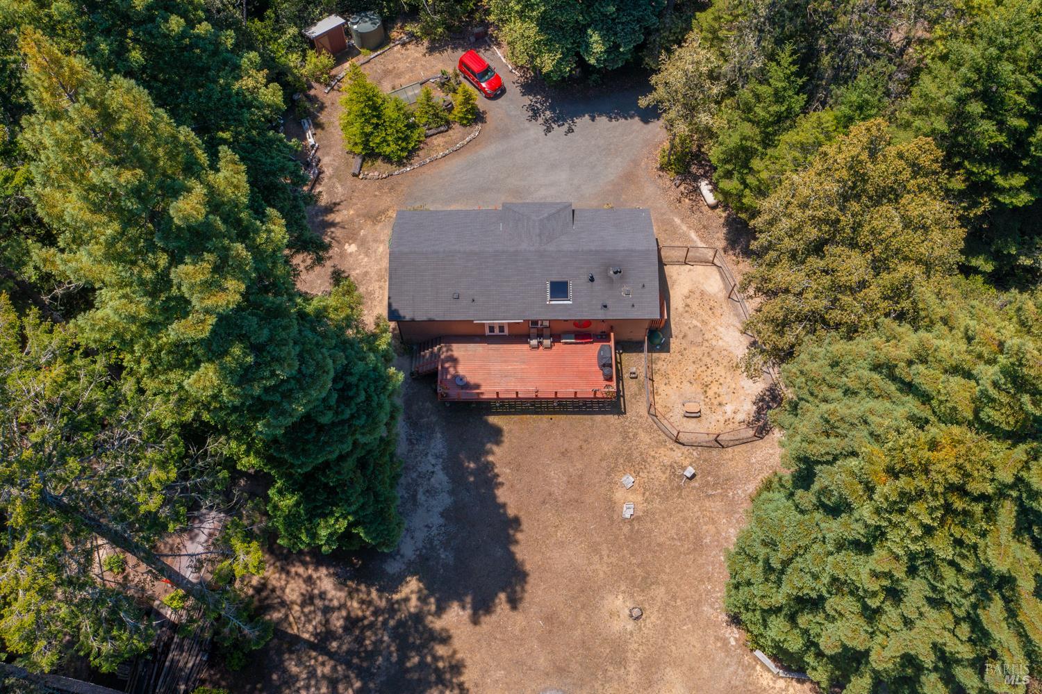 28001 Tenmile Road Gualala, CA 95445 - Photo 25 of 32 an aerial view of a house with a yard and large trees