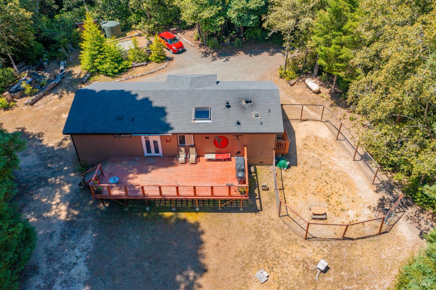28001 Tenmile Road Gualala, CA 95445 - Photo 28 of 32 an aerial view of a house with a yard
