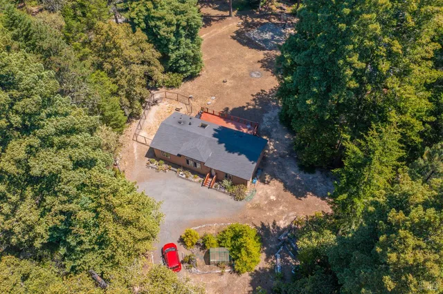an aerial view of house with yard swimming pool and outdoor seating