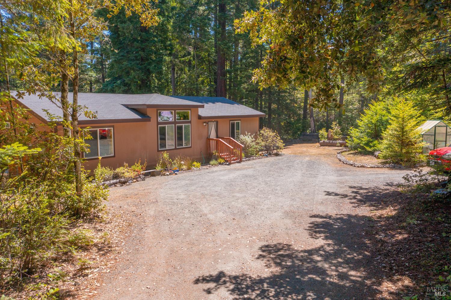 28001 Tenmile Road Gualala, CA 95445 - Photo 30 of 32 a view of a house with a yard