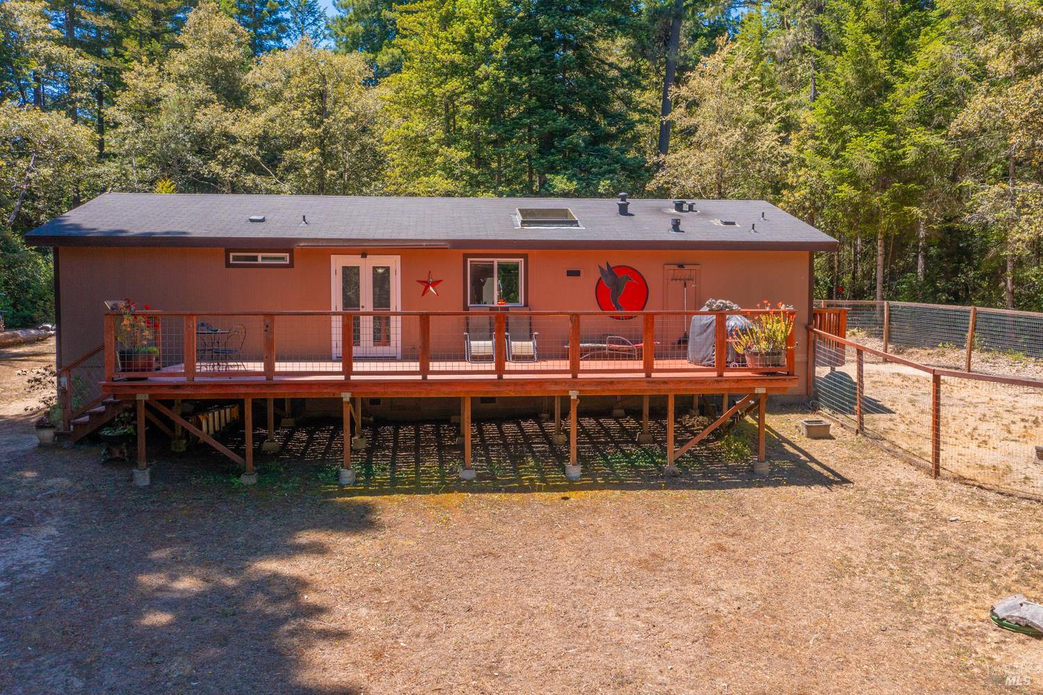 28001 Tenmile Road Gualala, CA 95445 - Photo 3 of 32 front view of a house with a yard