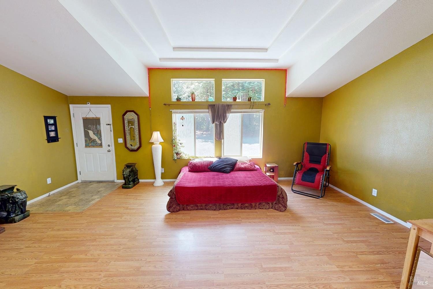 28001 Tenmile Road Gualala, CA 95445 - Photo 4 of 32 a bedroom with a bed and window