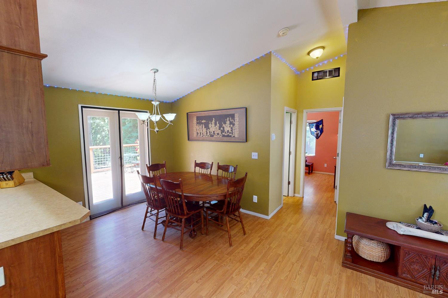 28001 Tenmile Road Gualala, CA 95445 - Photo 9 of 32 a view of a dining room with furniture and wooden floor