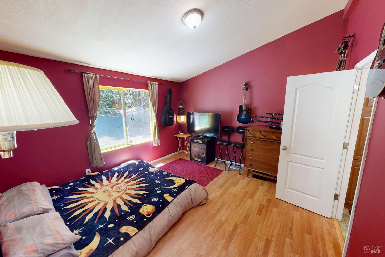 28001 Tenmile Road Gualala, CA 95445 - Photo 10 of 32 a bed room with a bed and a window