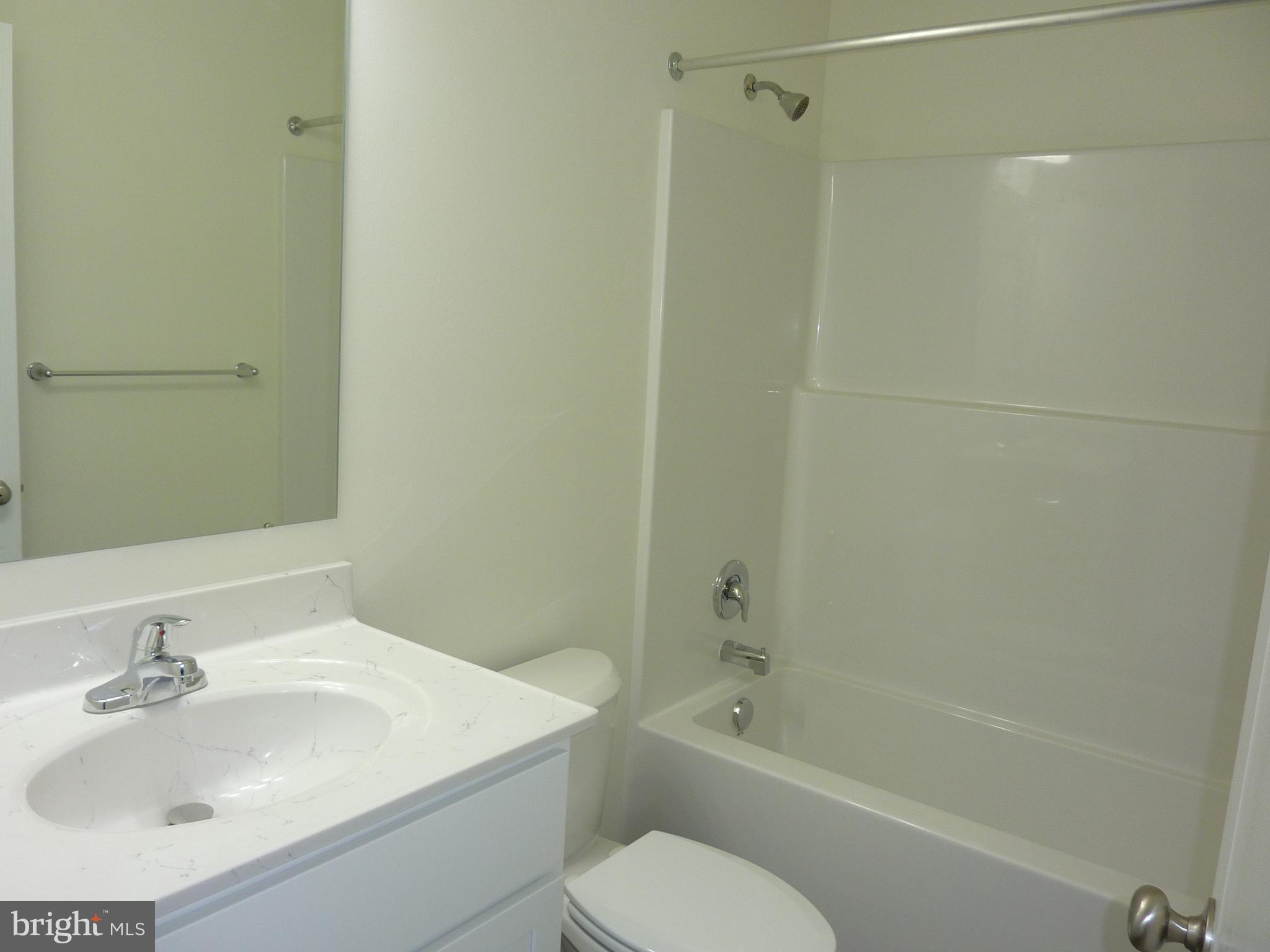 272 Doylestown Road Smyrna, DE 19977 - Photo 24 of 34 a bathroom with a sink toilet and shower