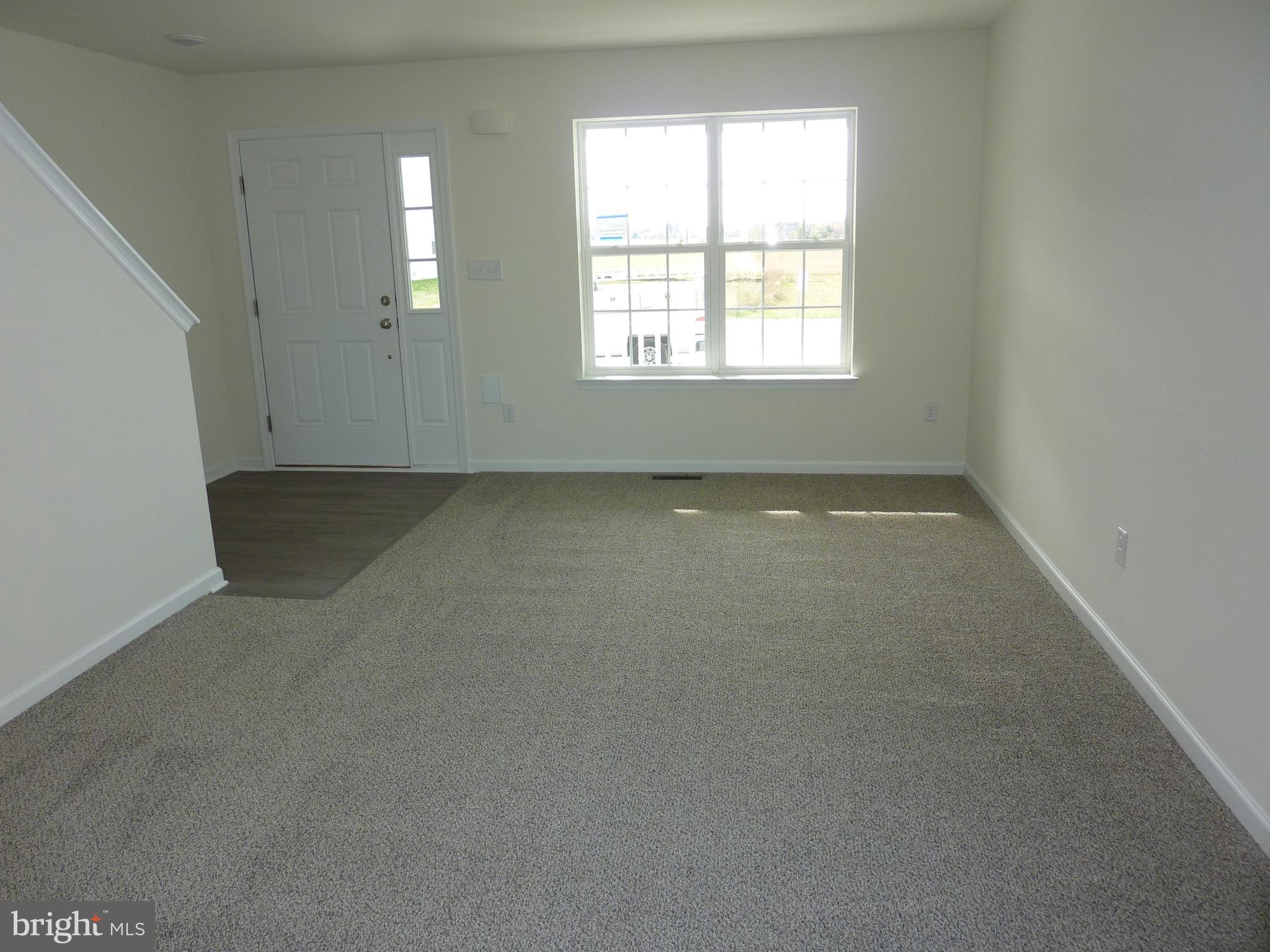272 Doylestown Road Smyrna, DE 19977 - Photo 5 of 34 an empty room with a window