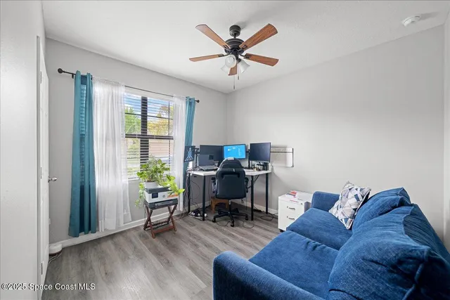 a living room with furniture and a window