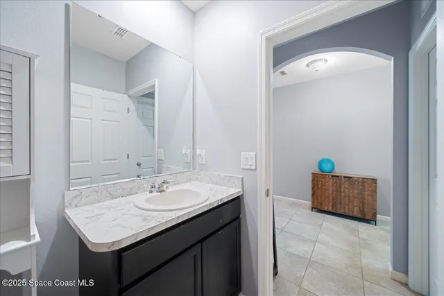 a bathroom with a sink double vanity and a mirror