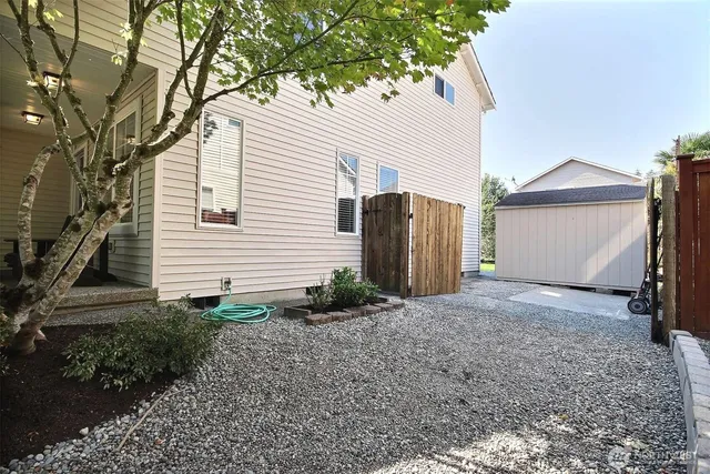 a view of a house with a yard and garage