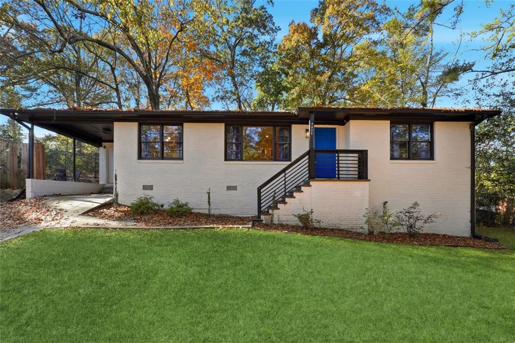 a house that has a big yard in front of it