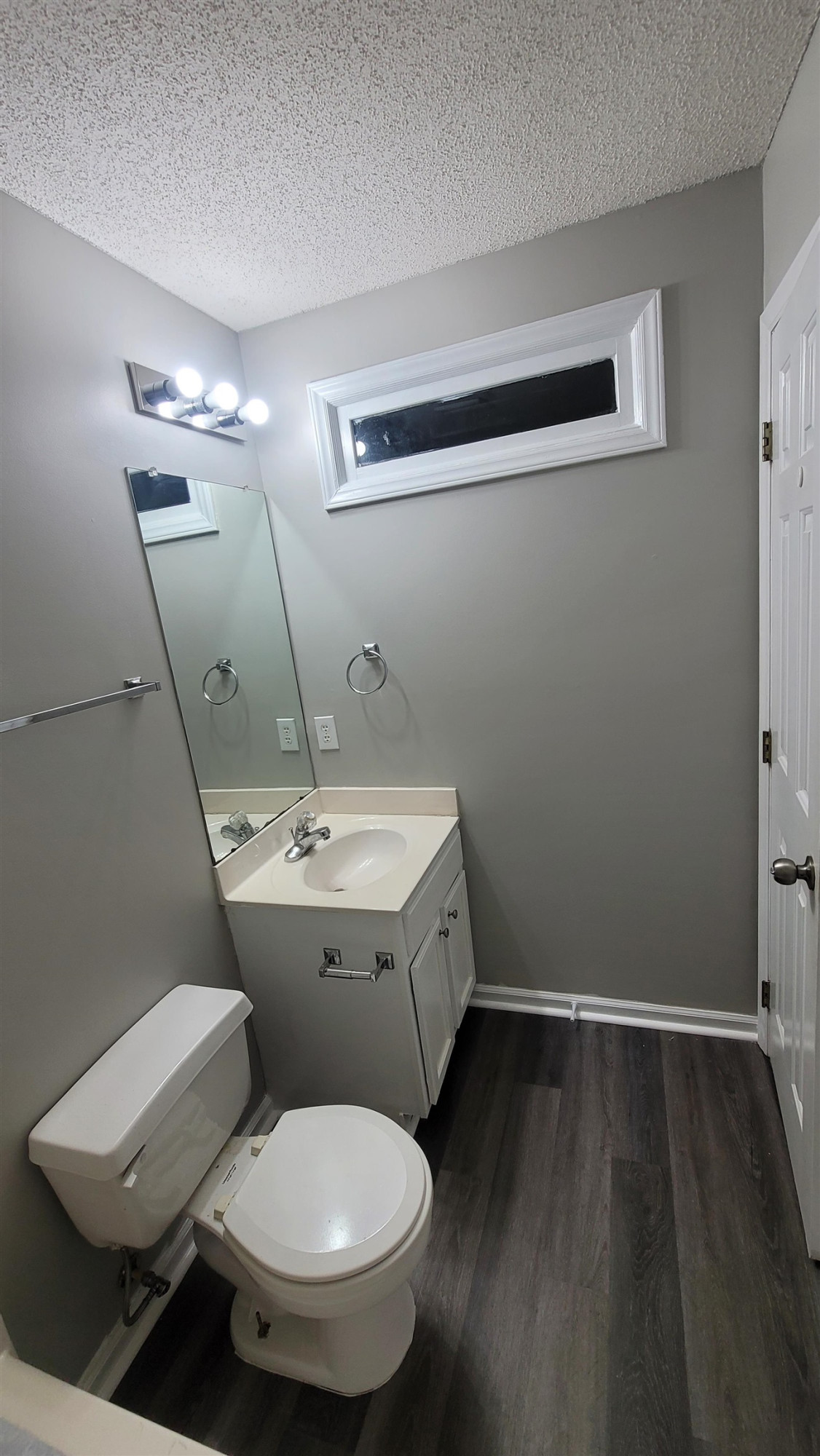 3809 Axle Lane Raleigh, NC 27616 - Photo 12 of 30 a bathroom with a toilet sink and mirror